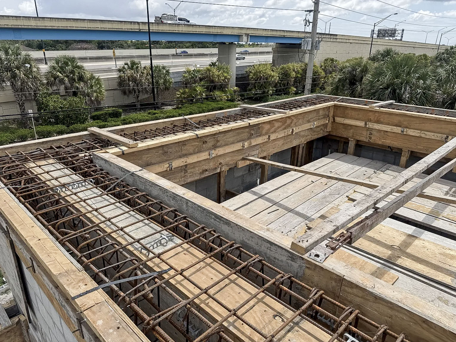 Reinforcing steel prepared at roof level beside a Florida highway
