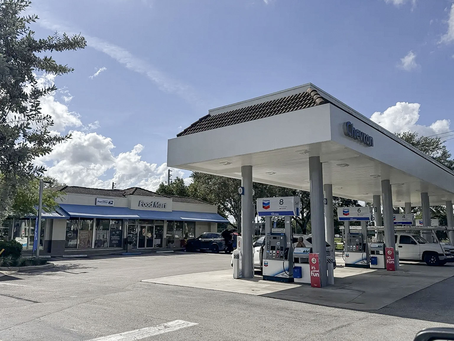 Chevron fuel canopy, dispensers, and convenience store entrance